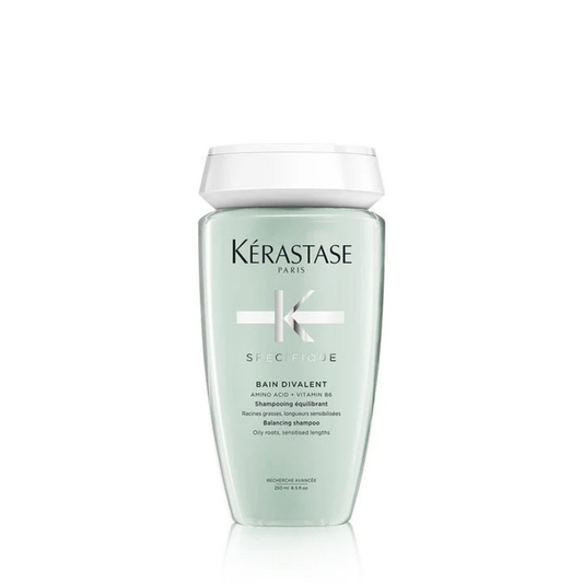 Kérastase Spécifique Bain Divalent Balancing Shampoo cleanses oily roots and nourishes dry ends — available at Bauhaus Salon + Spa Lake Charles.
